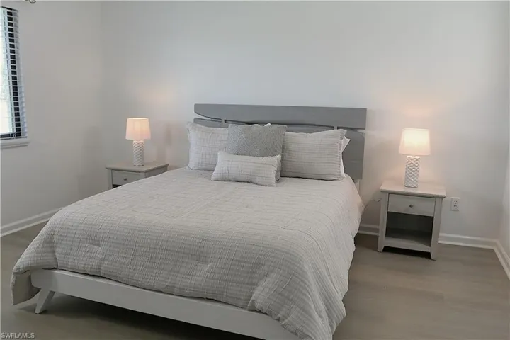 Bedroom featuring baseboards and light wood-style floors