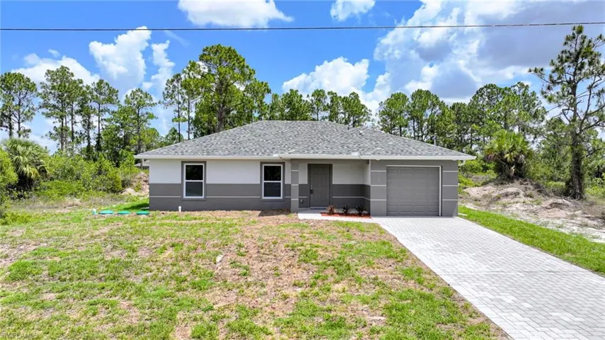 Amazing New Construction 3 Bedroom/2 Bathroom Home On A 1/4 Acre Canal Lot In Lehigh Acres! Fish From Your Own Back Yard!