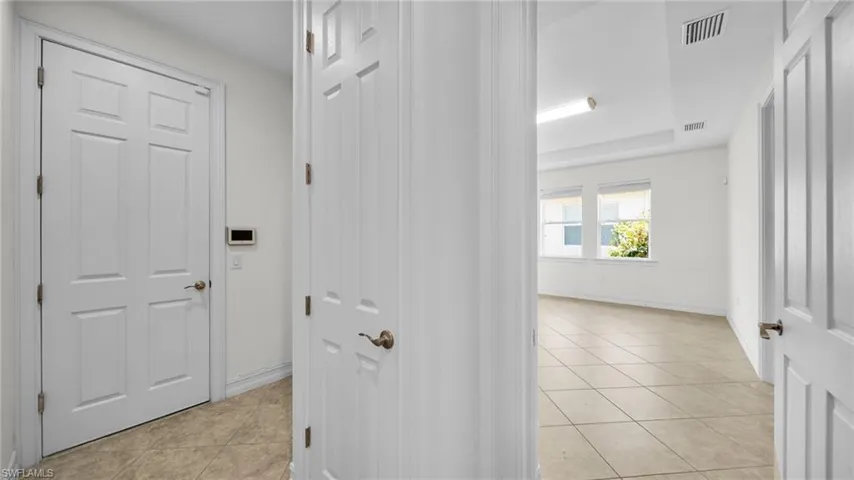 Hall with entrance to garage and Guest Ensuite