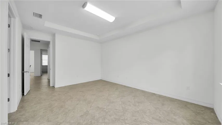 Guest Living with Tall Tray ceiling, Tile Floor