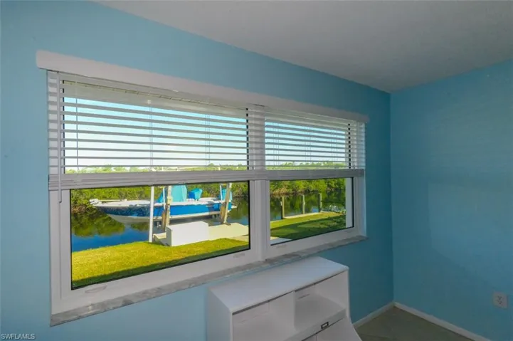 Guest bedroom featuring a water view