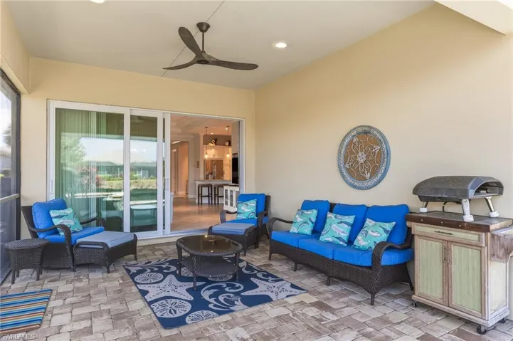 View of patio with outdoor furniture and ceiling fan