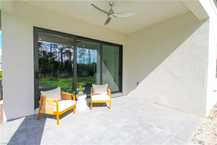 View of patio featuring ceiling fan