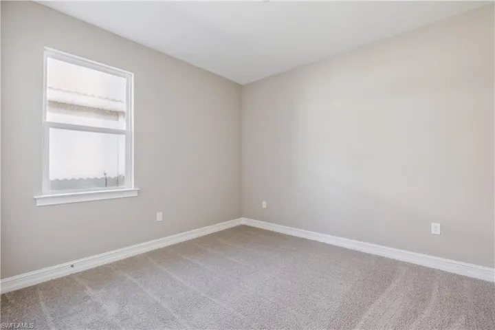 Unfurnished room featuring carpet
