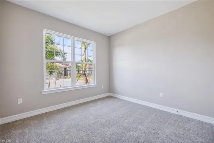 Unfurnished room with carpet floors