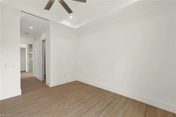 Unfurnished room featuring ceiling fan and light hardwood / wood-style floors