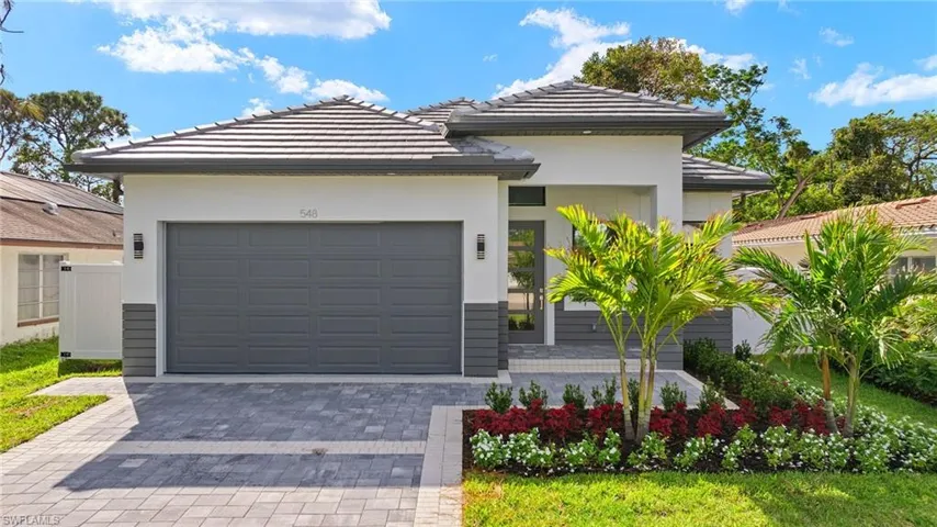 View of front of property featuring a garage