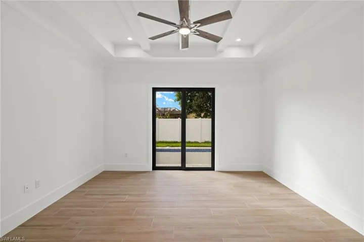 Empty room featuring light hardwood / wood-style floors and ceiling fan