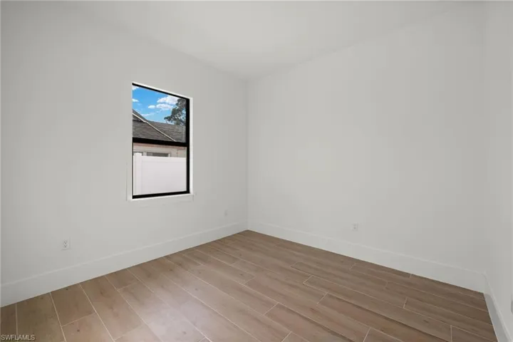 Empty room featuring light wood-type flooring