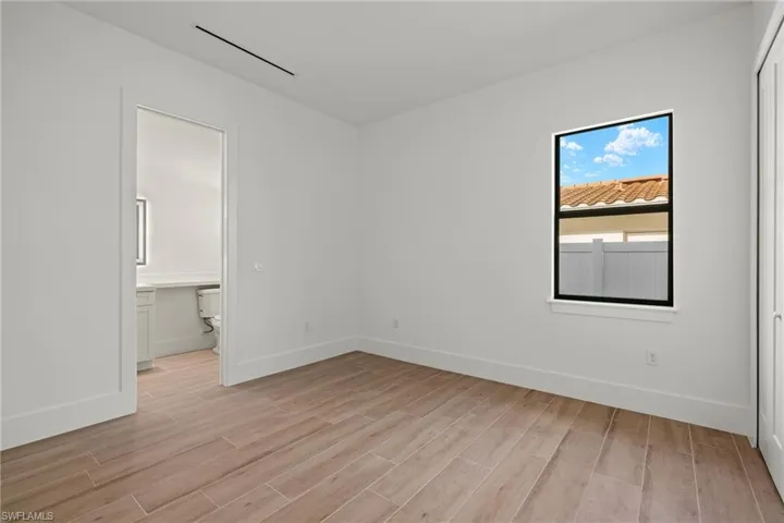 Spare room featuring light wood-type flooring