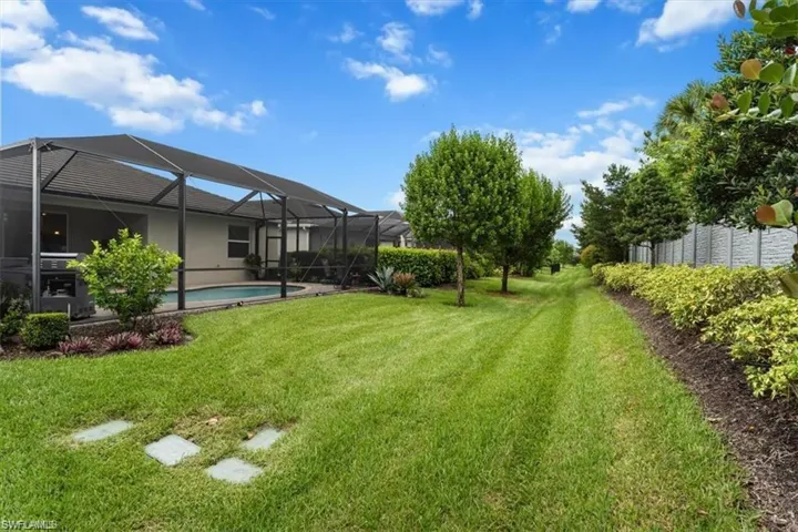 View of green lawn with glass enclosure