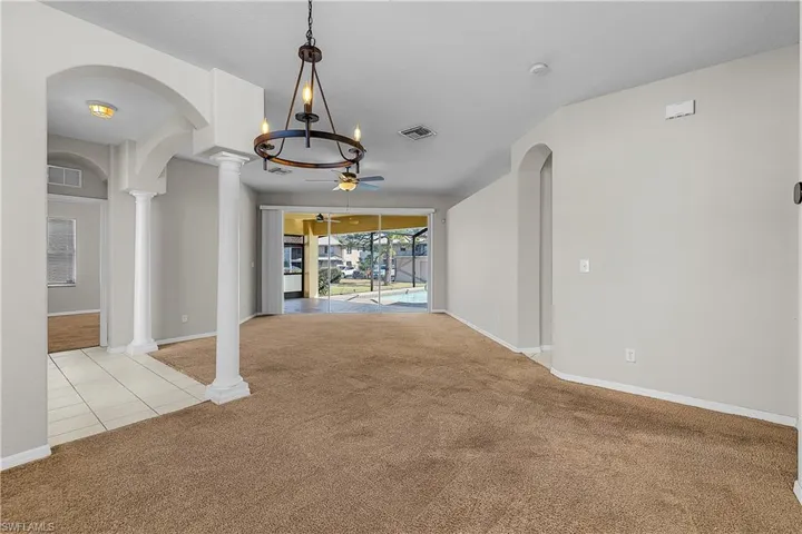 Formal Open Dining/Livingroom with Sliders to Lanai & Pool