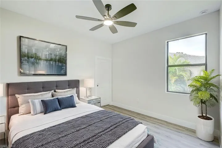 Bedroom featuring a ceiling fan and wood finished floors