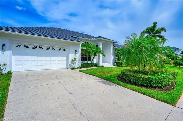 Ranch-style home featuring a garage