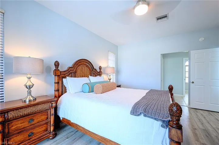 Bedroom featuring light hardwood / wood-style flooring and ceiling fan