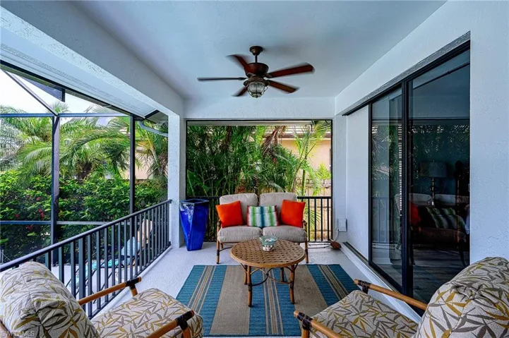 Sunroom / solarium featuring a wealth of natural light and ceiling fan