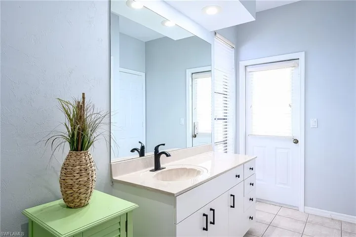 Bathroom featuring vanity and tile patterned floors