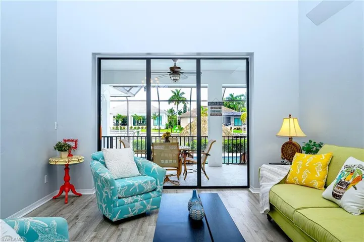 Living room featuring ceiling fan and hardwood / wood-style floors