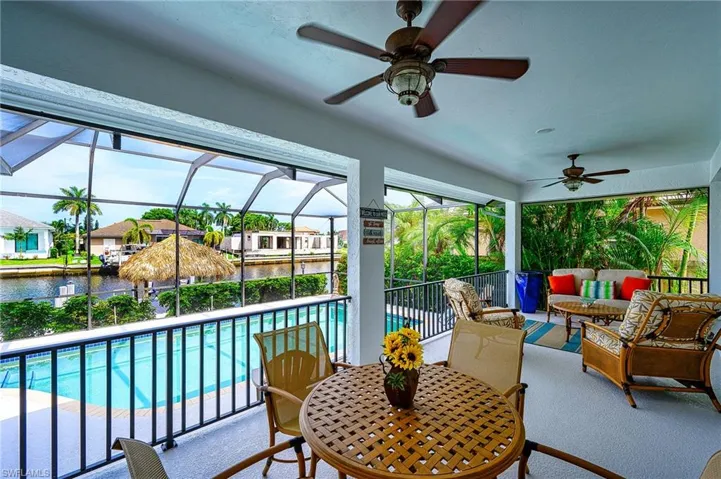 Sunroom / solarium featuring ceiling fan