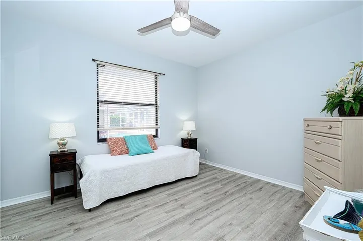 Bedroom featuring light hardwood / wood-style flooring and ceiling fan