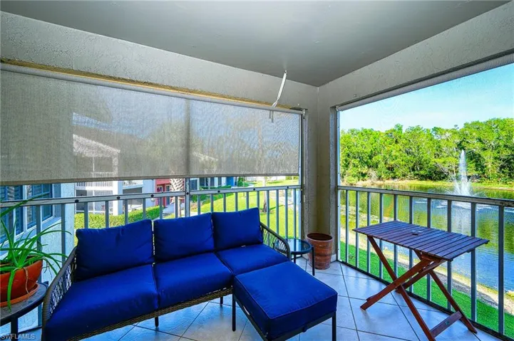 Sunroom with a water view