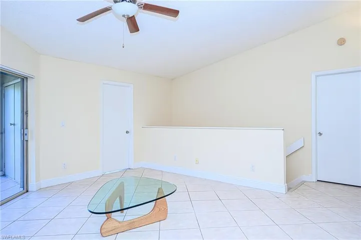 Tiled living room with ceiling fan