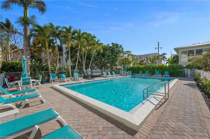 Pool featuring fence and a patio