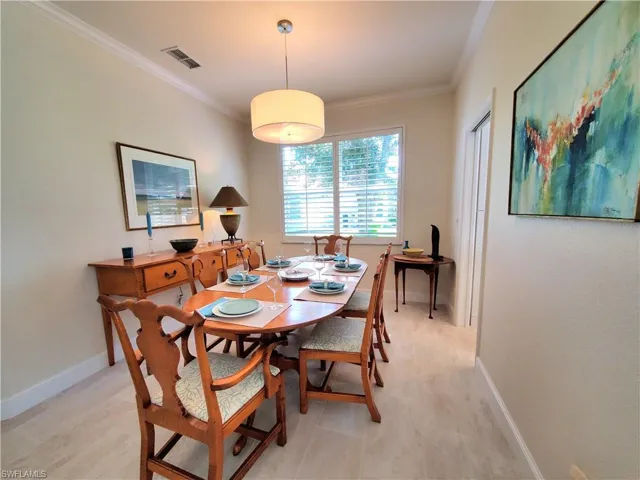 Dining space with crown molding