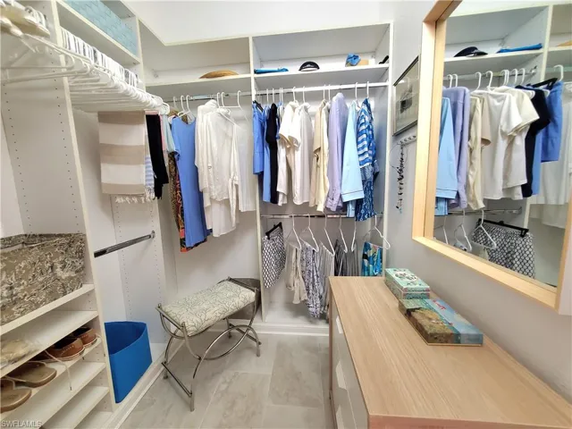 Walk in closet featuring tile flooring