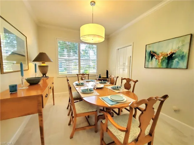 Dining space with ornamental molding