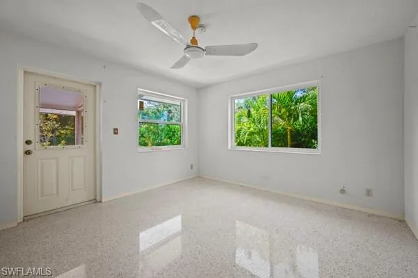Unfurnished room featuring ceiling fan
