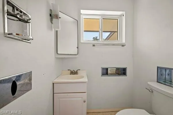 Bathroom with vanity and toilet