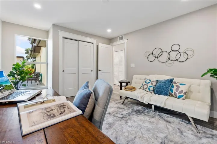 Office area with hardwood / wood-style floors