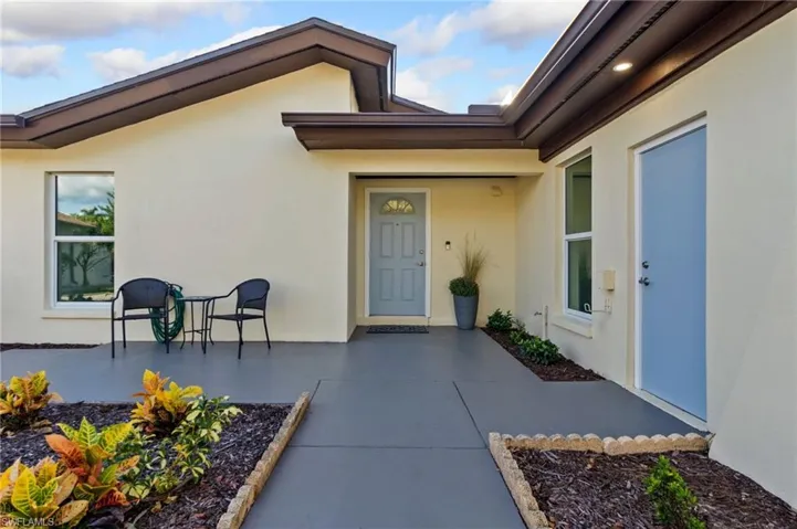 View of exterior entry featuring a patio area
