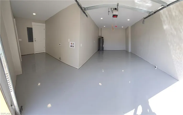 Spacious 1+ deep garage with L shaped laundry area !