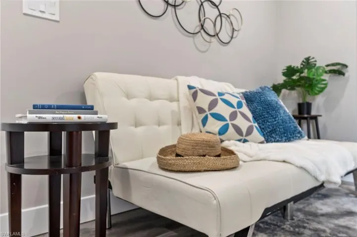 Living area with hardwood / wood-style floors