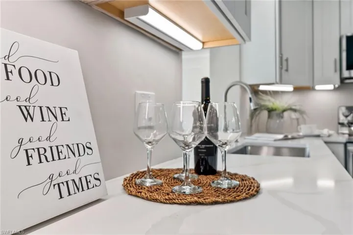 Details featuring white cabinets and sink
