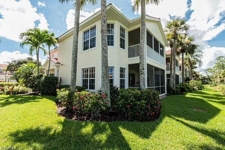 View of side of property with a lawn