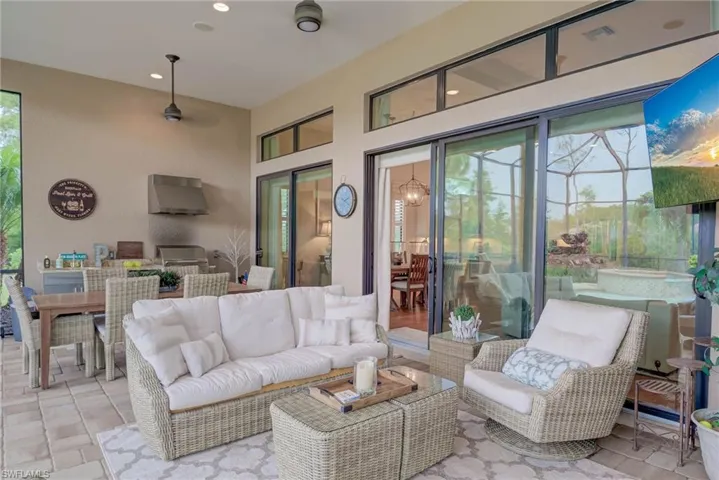 View of patio / terrace with outdoor dining space, an outdoor hangout area, and area for grilling