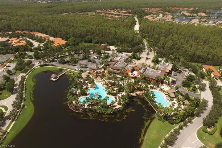 Aerial overview of property's location featuring a pool area and a large body of water