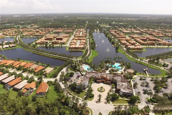Aerial view of property's location featuring nearby suburban area and a large body of water