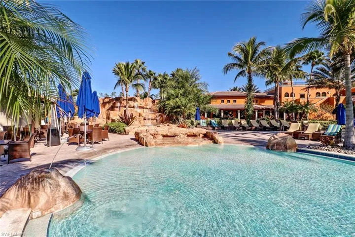 Community pool with a patio