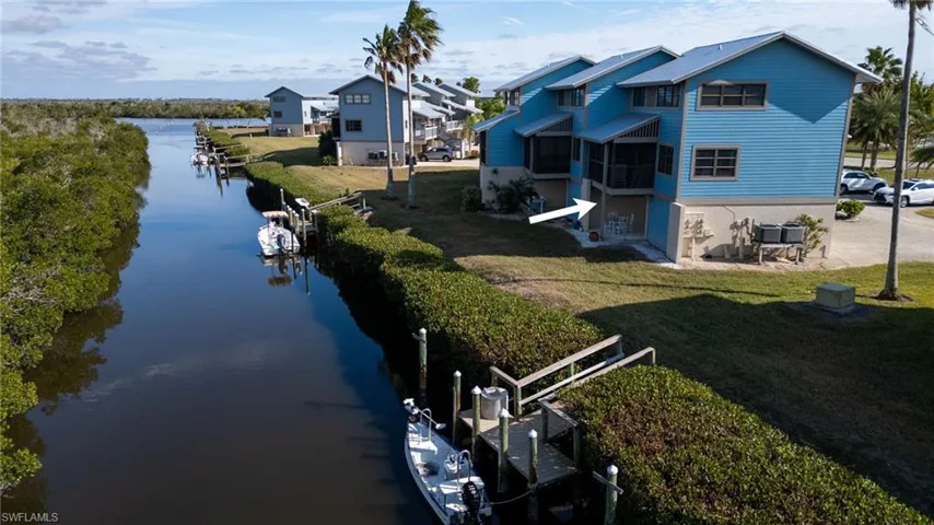View showing W and N sides of this end-unit and proximity to the docks and direct Gulf access canal