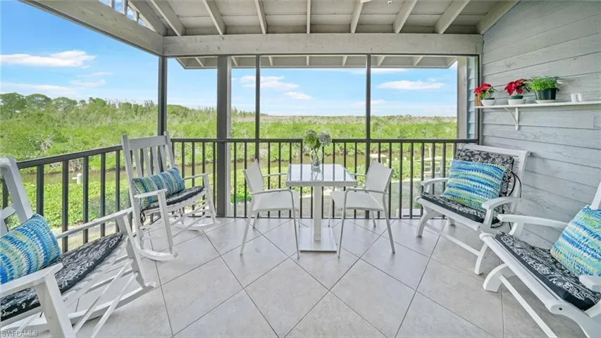 Screened balcony off the living room via pocket slider and both N and W views over canal and mangrove preserve