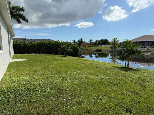 Fresh water canal, seawall, and yard