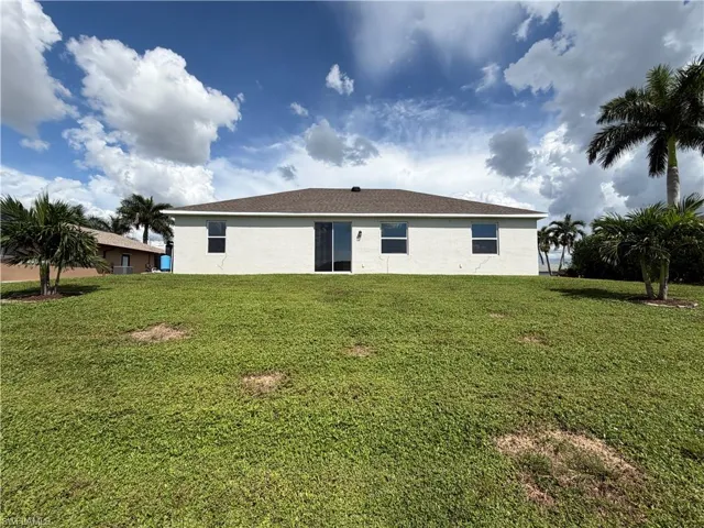 Landscaped yard and back of the home