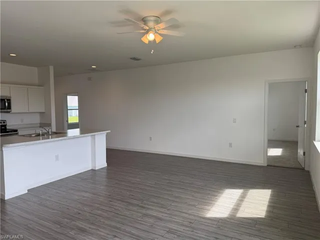 Living room and entrance to master bedroom