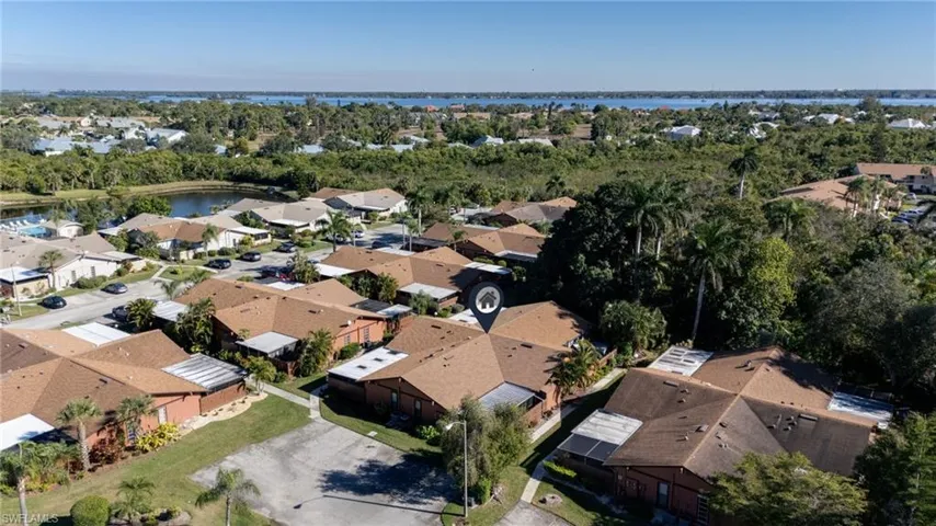 Aerial view of property's location featuring nearby suburban area