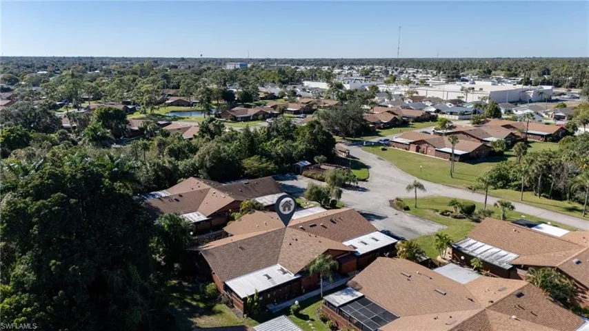 Aerial view of property's location featuring nearby suburban area