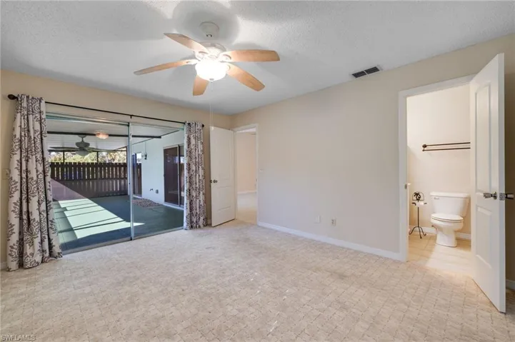Empty room featuring a textured ceiling and ceiling fan